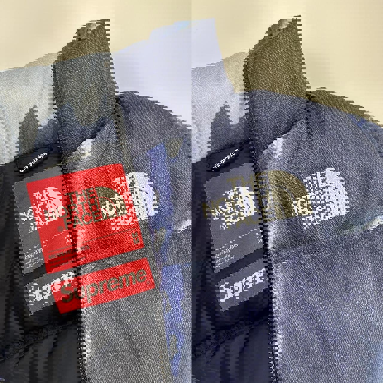 Supreme x The North Face TNF Bleached Denim Print Nuptse Puffer jacket in blue. Released in FW21.