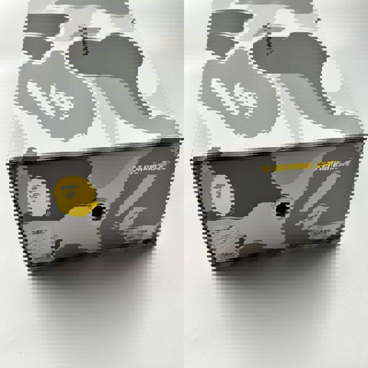 BAPE x JJJJound Bapesta sneakers in grey and white.