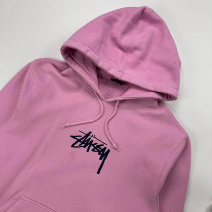 Stussy hoodie in pink with navy blue embroidered logo.