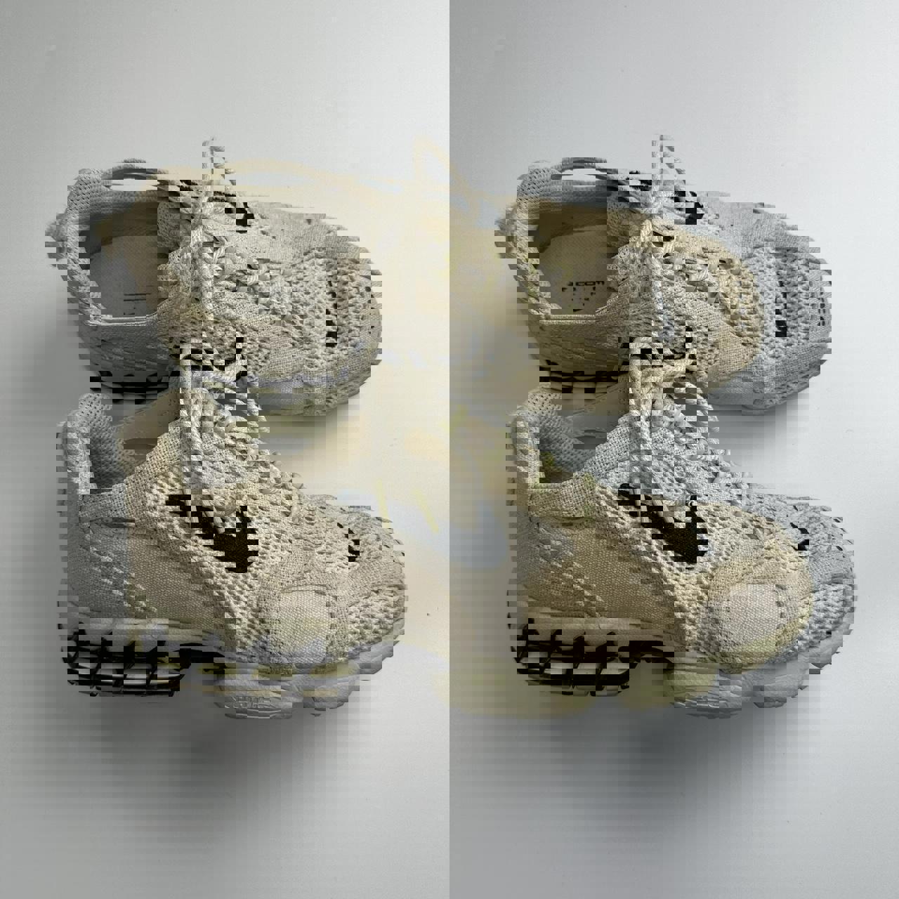 Nike x Stussy Zoom Spiridon sneakers in cream.