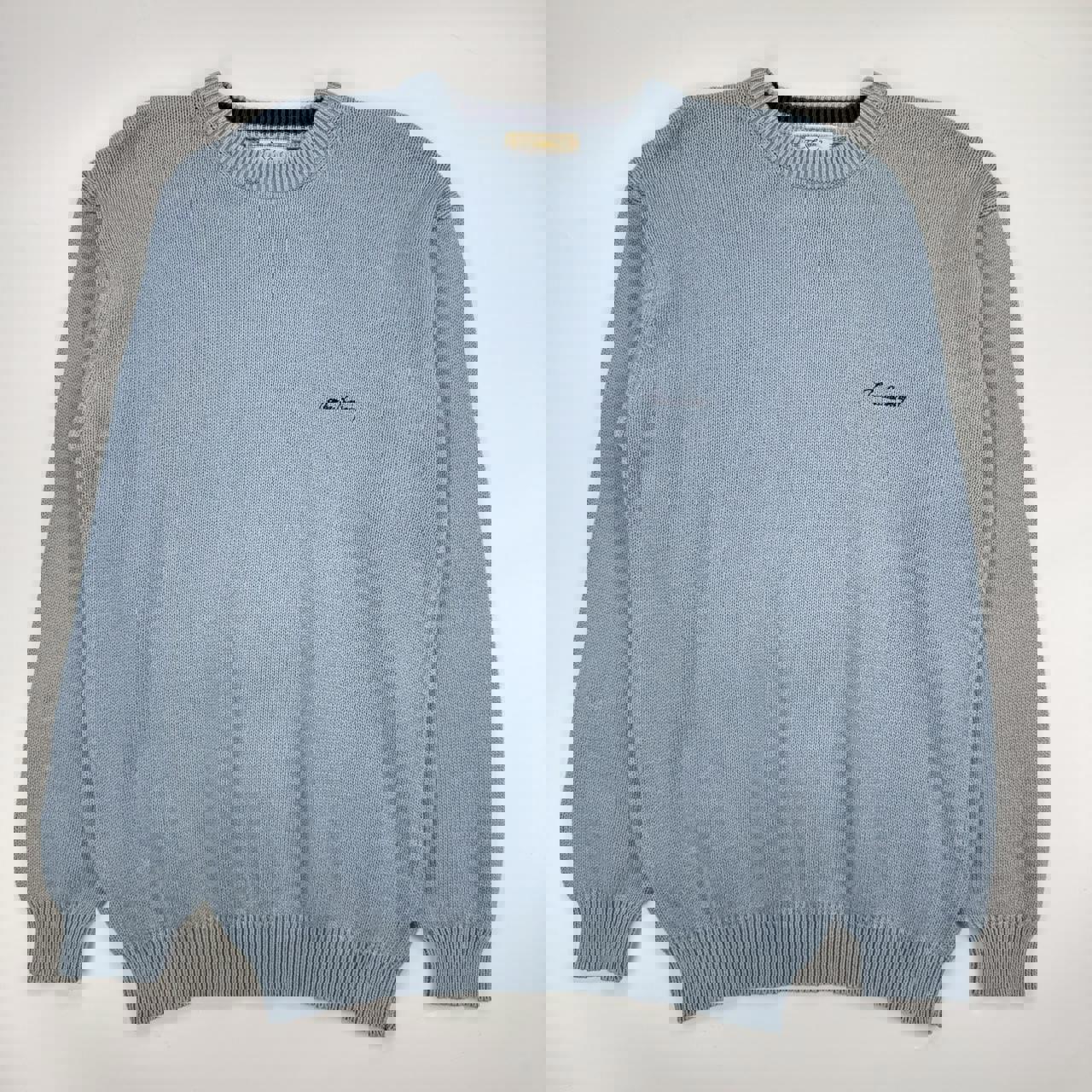 Vintage Burberry knitted jumper in baby blue with navy embroidered logo.