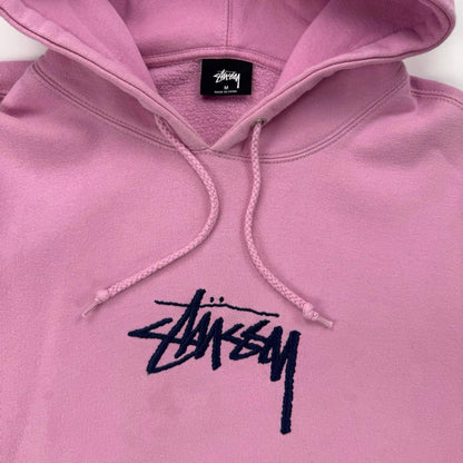 Stussy hoodie in pink with navy blue embroidered logo.