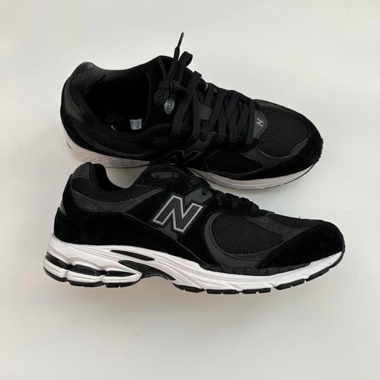 New Balance 2002R black gunmetal sneakers.
