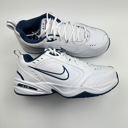 Nike Air Monarch sneakers in blue and white.