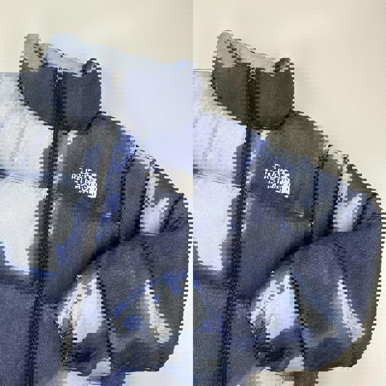 Supreme x The North Face TNF Bleached Denim Print Nuptse Puffer jacket in blue. Released in FW21.