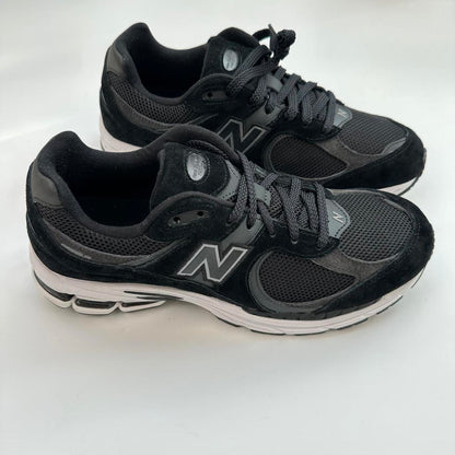 New Balance 2002R black gunmetal sneakers.