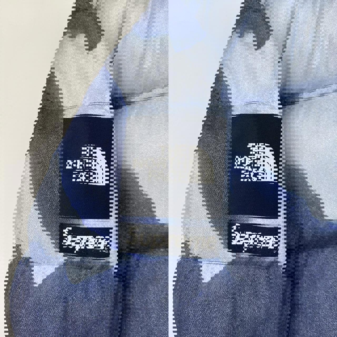 Supreme x The North Face TNF Bleached Denim Print Nuptse Puffer jacket in blue. Released in FW21.
