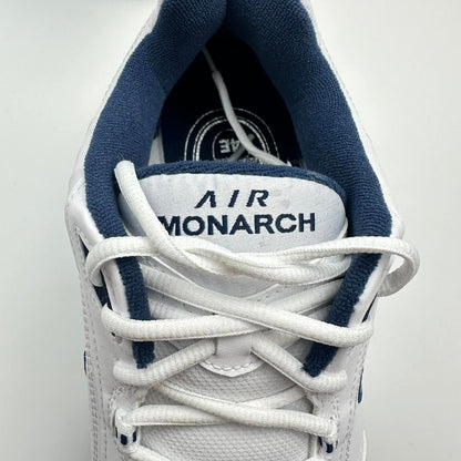Nike Air Monarch sneakers in blue and white.