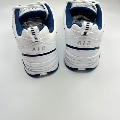 Nike Air Monarch sneakers in blue and white.